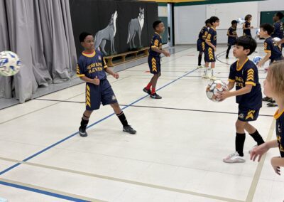 Youth basketball players in action during a game.