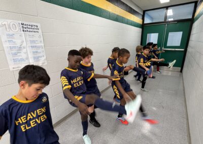 Young soccer players preparing in a locker room before a game.
